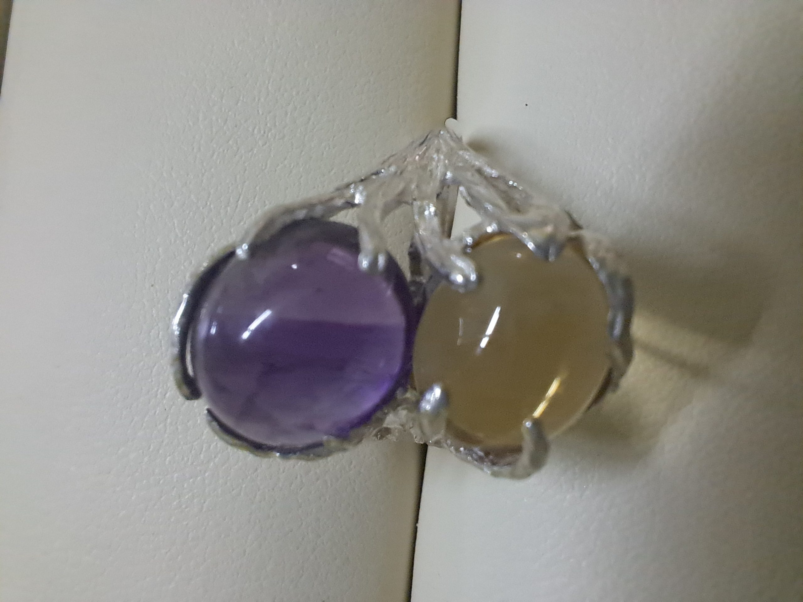 Silver ring with purple and yellow stone
